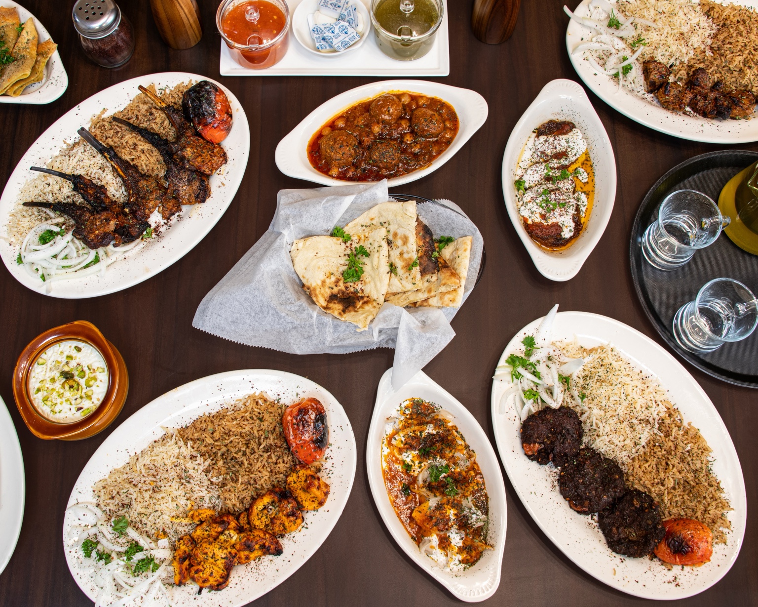 A family spread of Rumi Afghan dishes and bread